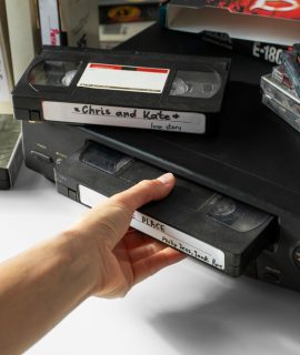 high-angle-hand-holding-old-cassette